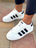 Adidas superstar blanche trois bandes noir ou bleu